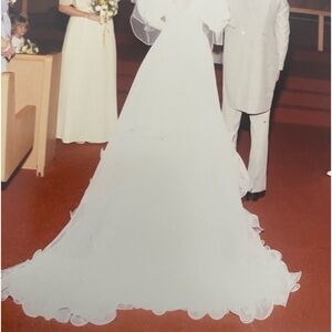 Vintage wedding dress. Has been in a sealed box.cleaned and sealed after wedding